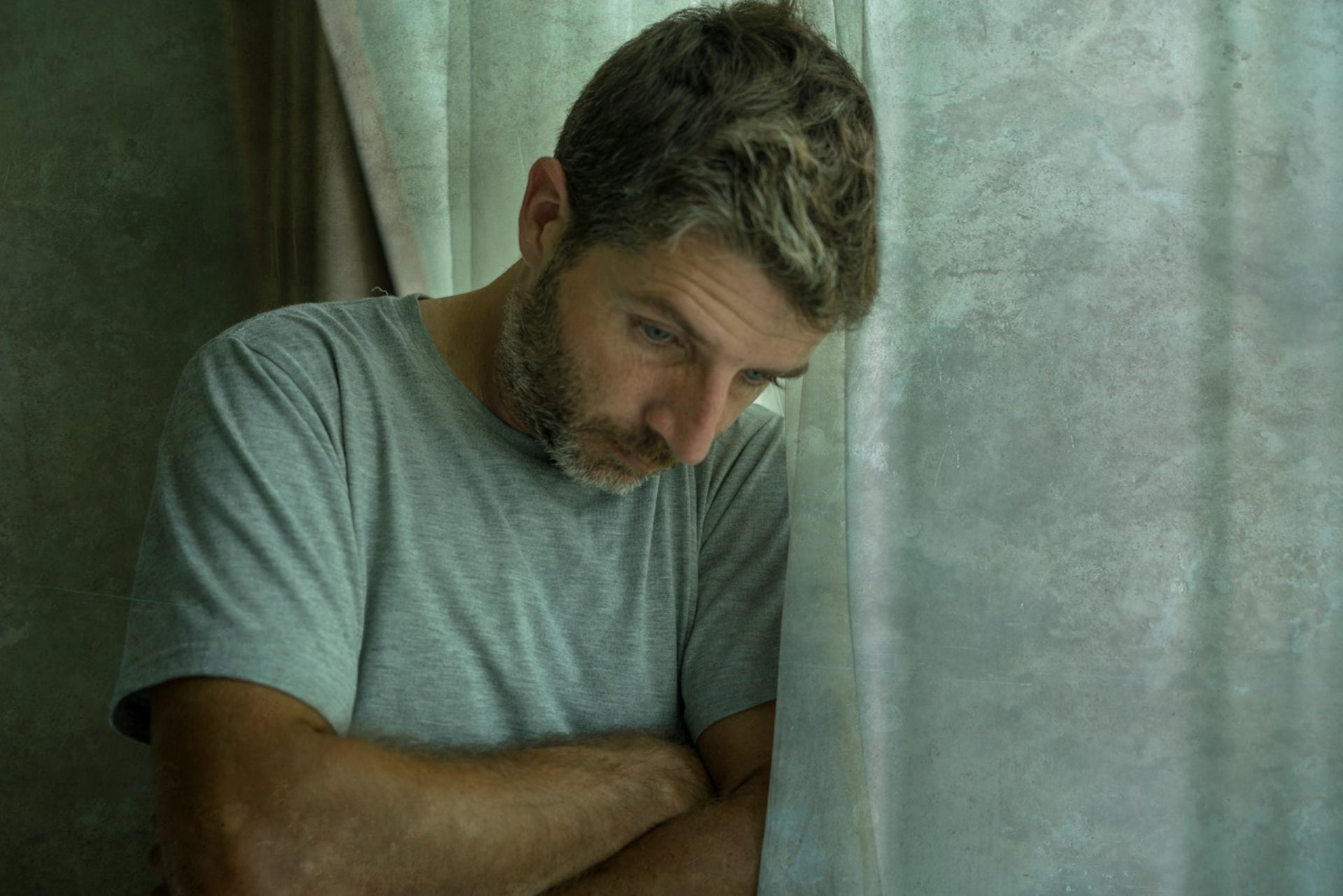 Man experiencing depression and isolation
