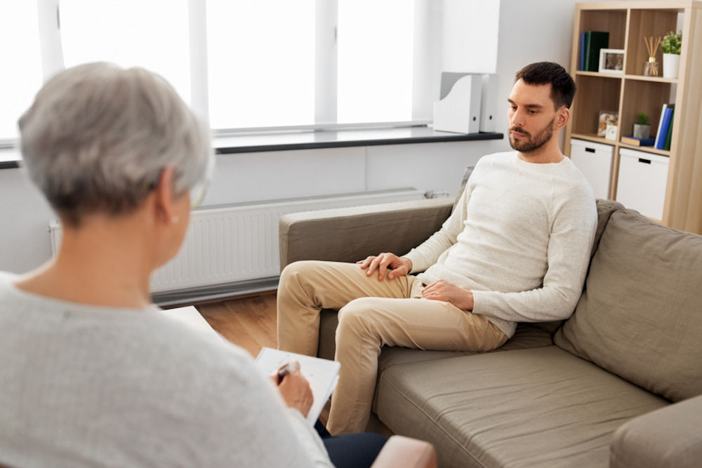 a guy attending individual therapy for addiction treatment