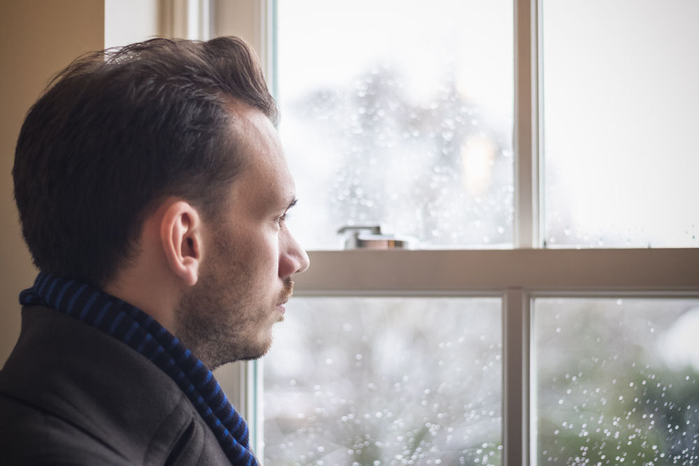 man experiencing paranoia triggered by substance abuse