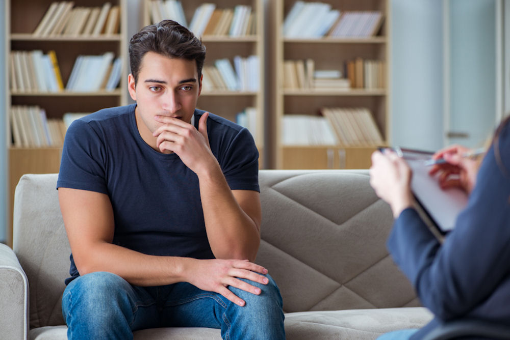 man receiving financial guidance in recovery Therapy