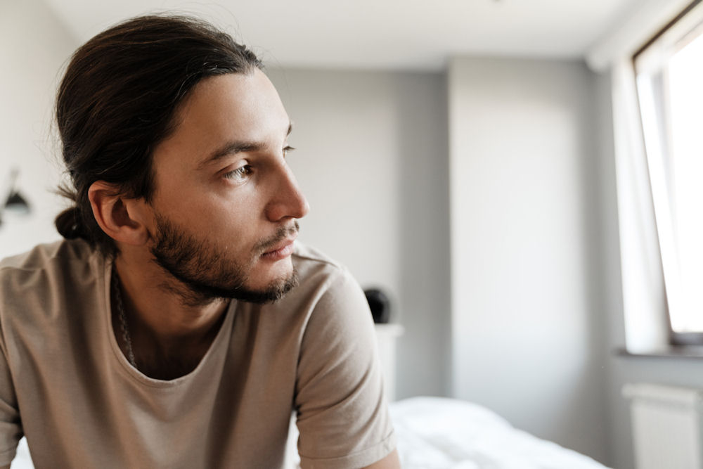 man experiencing alcohol-related mood swings and distress
