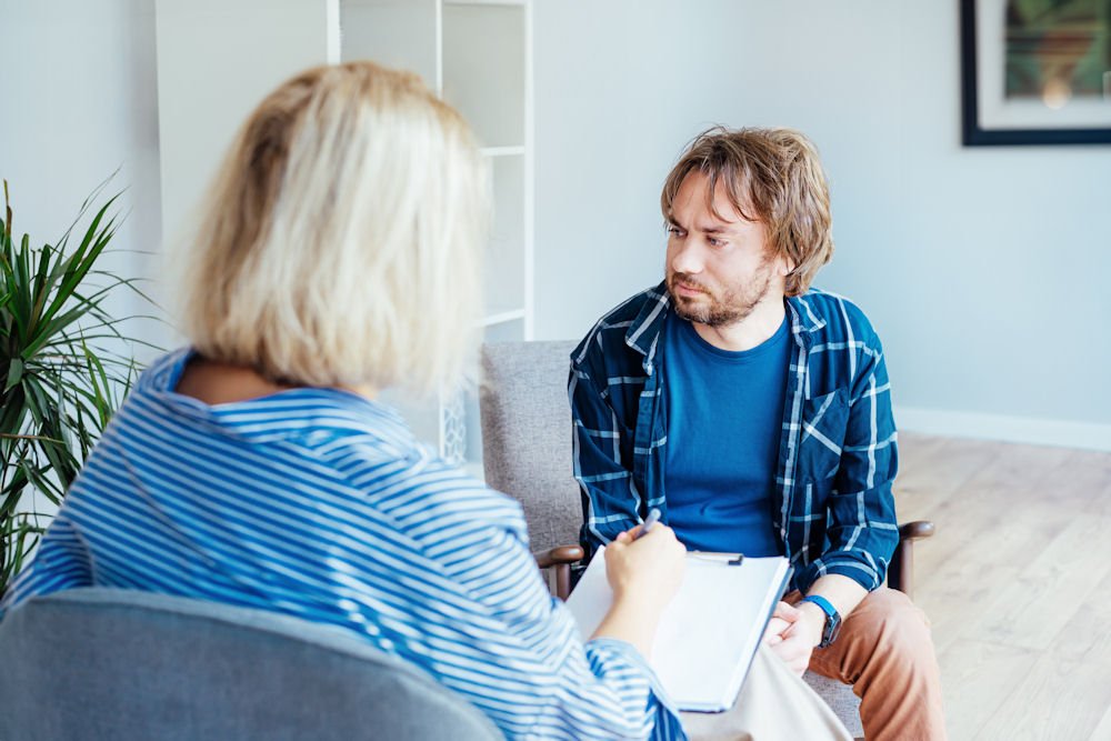 man in PTSD and addiction treatment